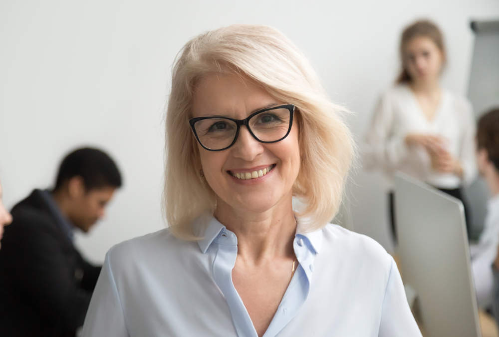 Ripple Learning -  Professional lady wearing glasses smiling