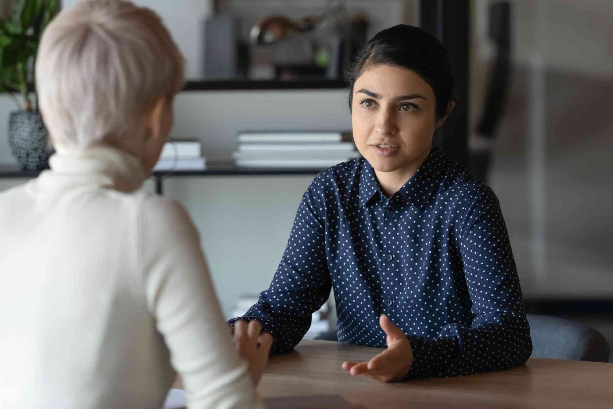 Ripple Learning - Two professional females having a serious discussion in an office - Courageous Conversations - Corporate Training